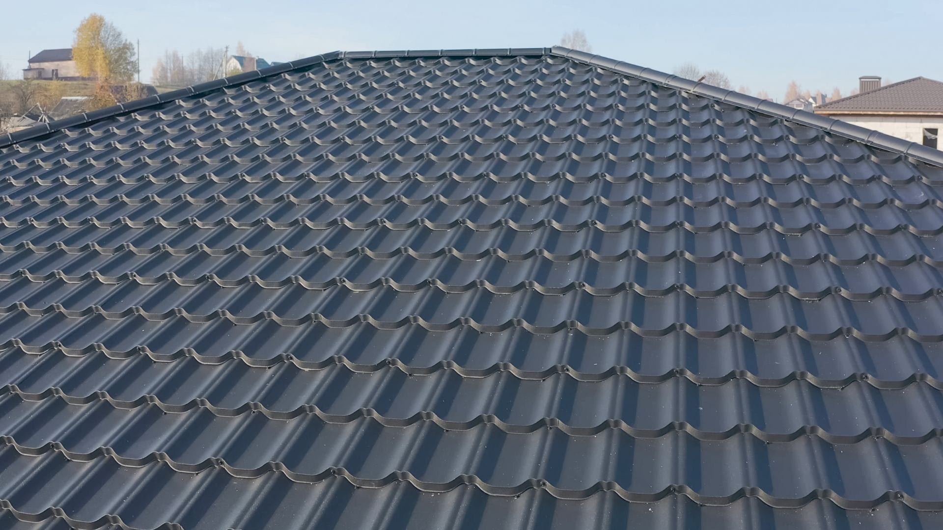 New charcoal metal roof running to the ridge on a coastal Carolina home