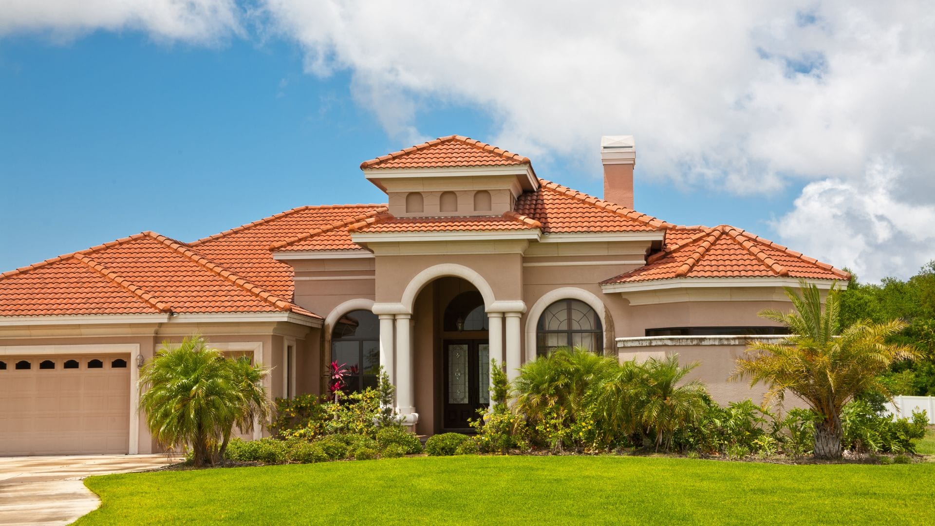Clay barrel tile roof on a large coastal home