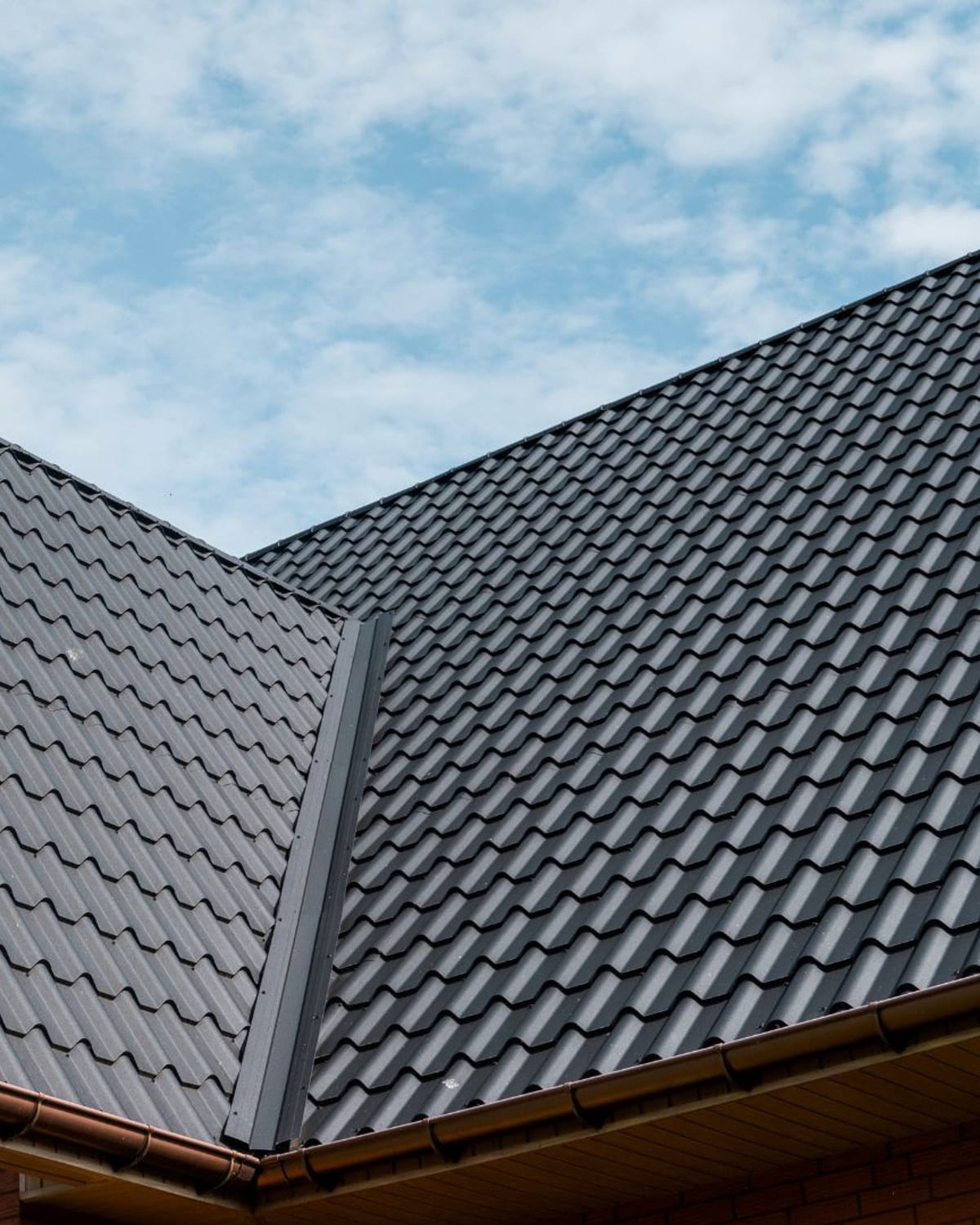 Metal roof valley and trim detail on a brick home in coastal Carolina