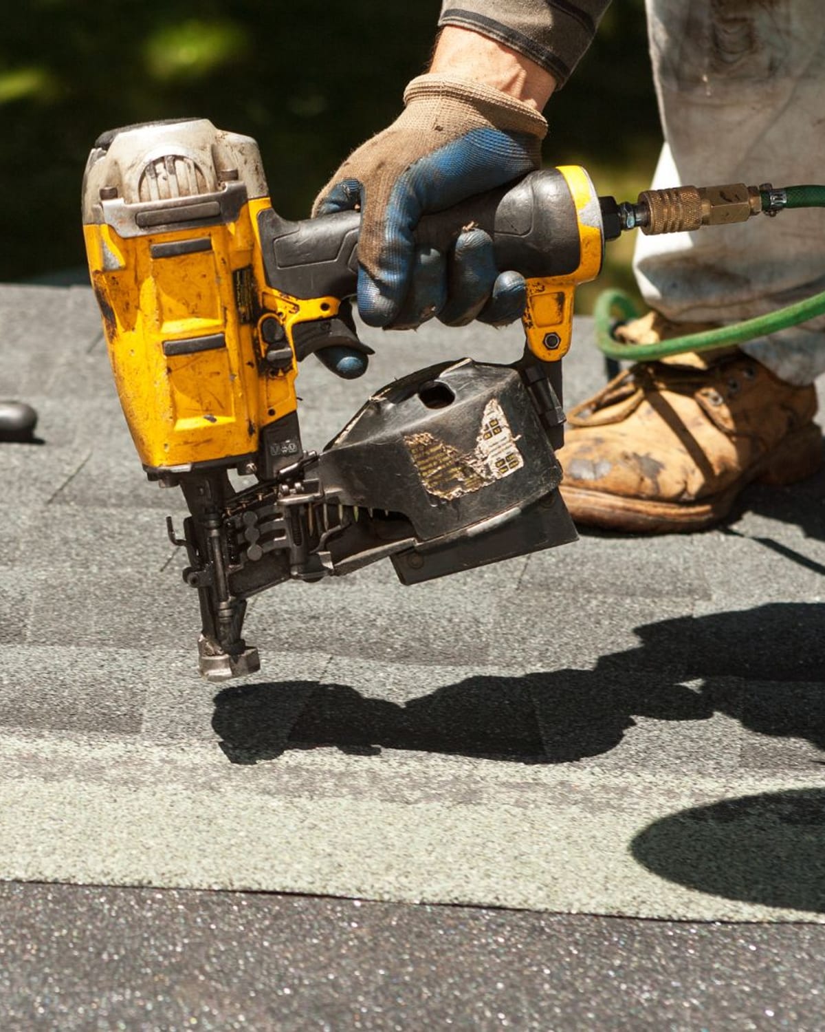 Fasteners being driven on the nail line during a warrantied roof installation